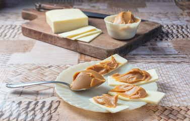Sliced ​​cheese with milk sweet. With selective focus.