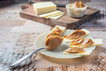 Sliced ​​cheese with milk sweet. With selective focus.