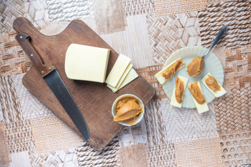 Fototapeta na wymiar Sliced ​​cheese with milk sweet. With selective focus.