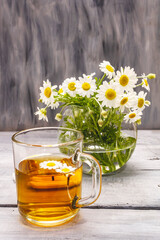 Chamomile tea. Fresh flowers, summer hot drink concept. Alternative medicine, lifestyle