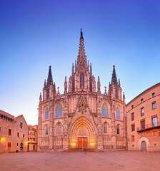 Fototapeta na wymiar Cathedral of Barcelona at night. Gothic Barcelona Cathedral at dawn with rising Sun, panoramic image.