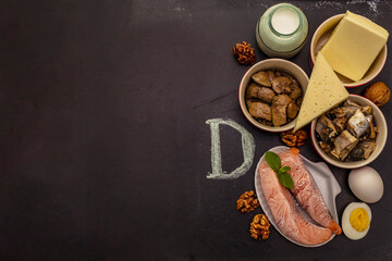 Obraz na płótnie Canvas Foods containing vitamin D. Cheese, eggs, butter, nuts, milk, sardine