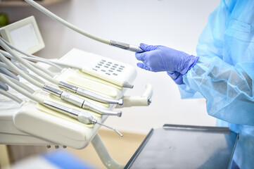 Dentist sterilize the medical equipment inside a dental clinic during the corona virus pandemic