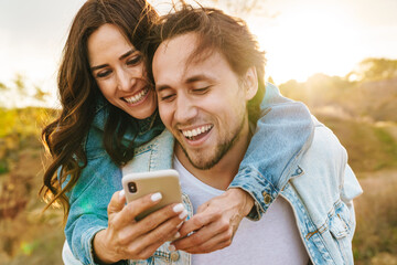Beautiful happy young couple in love spending time together