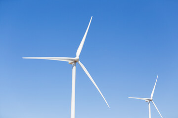 Fototapeta premium Propellers of the wind generator against blue sky
