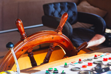 ship steering wheel in the captain's cabin