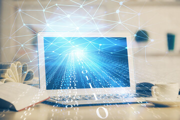 Double exposure of desktop computer and technology theme hologram. Concept of software development.