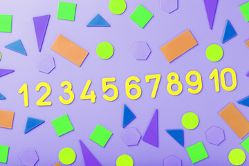 Colorful figures and numbers for children on a pink background. A tool for developing children's thinking.