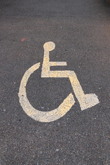 Parking sign for the disabled on the asphalt. vertical photo
