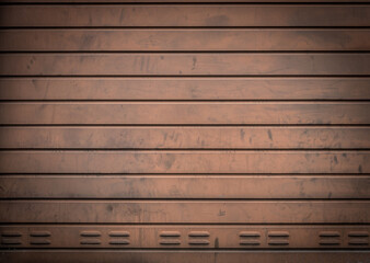 Grungy weathered metallic roll up door. Rusty iron gate.
