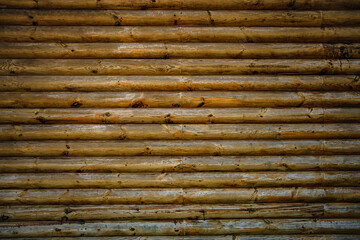 Wooden background, texture. Wall of wooden bars
