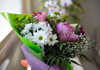 Bouquet of flowers at the window
