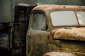 old rusty car, wrecked automobile in the parking lot
