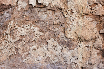 Texture of different layers of clay on the edge of a cliff. Closeup