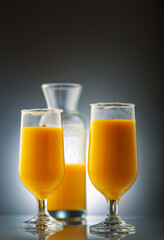 mango smoothie in clear glasses to drink