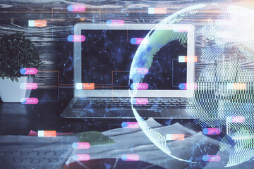 Multi exposure of table with computer and world map hologram. International data network concept.