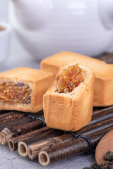 Pineapple cake pastry - Taiwanese famous sweet delicious dessert food with tea, close up, copy space design.