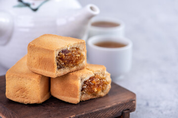 Pineapple cake pastry - Taiwanese famous sweet delicious dessert food with tea, close up, copy space design.