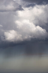Naklejka na ściany i meble rain clouds hanging over the sea
