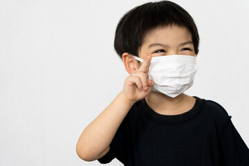 Asian boy waring mask for protect corona virus.