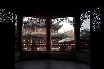 Fototapeta na wymiar February 2019. A rainy day at Yuyuan Garden. It is a classic Chinese garden that rises in the northeast of Shanghai's old city.
