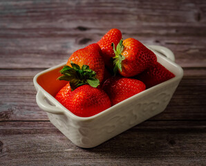 fragrant and sweet strawberries on a wooden background. High quality photo