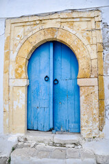 Fototapeta na wymiar Traditional old painted door in Sidi Bou Said, Tunisia.