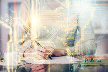 Multi exposure of hands making notes with world map hologram and data theme icons. Concept of global computer data.