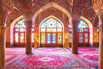 Famous pink mosque decorated with mosaic tiles and religious calligraphic scripts from Persian...