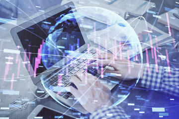 Double exposure of forex graph with man working on computer on background. Concept of market analysis.