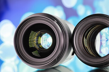 Equipment videographer and photographer. Lenses on the table against the background of bright...