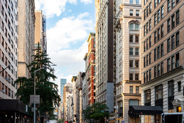 Fototapeta premium Sunlight shines on the buildings along Broadway through Midtown Manhattan, New York City