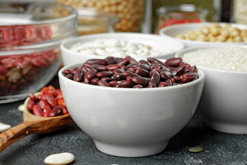 White ceramic bowls with assorted grains on kitchen table