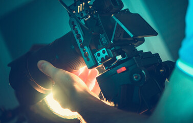 Naklejka premium Professional Camera Operator with Equipment in His Hands