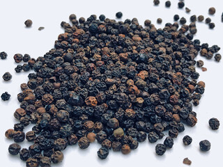 Black pepper on white background