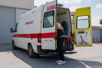 White ambulance, emergency medical service van with opened back door. © Bilal