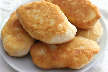 
Yeast cakes baked in butter. They are rosy and tasty. Golden crust crunches when eating