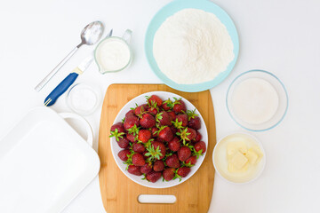 step by step recipe strawberry cobbler homemade from ripe fresh strawberries and shortbread on a light background, top view. ingredients for strawberry pie