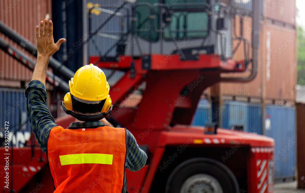 Poster foreman is controlling container loading in import-export business.