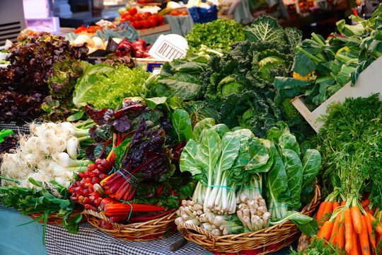 Vegetable stand at a marketplace. The Mercat de la Concepcio, market in Barcelona, Spain. 