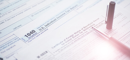 Obraz premium Annual tax reporting. Tax form on the table. Financial statements for signature.