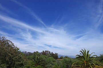 Fototapeta na wymiar Fantastic sky and clouds view over the a southern California landscape panorama with the Santa Ynez mountains in the background