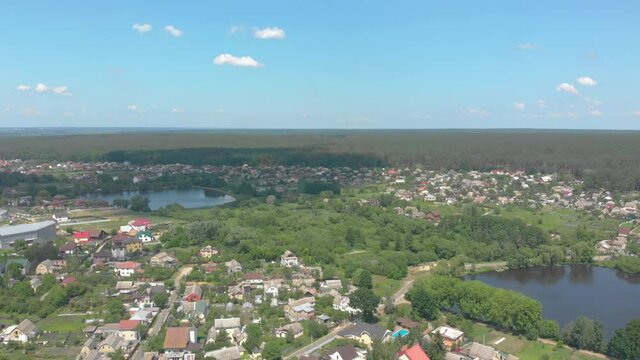Lakes forest and village summer aerial srone view left side camera movement