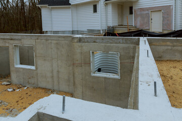 New home concrete house in the foundation for a new building with cement