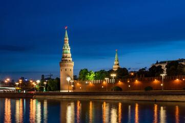 Fototapeta na wymiar Scenic view of Moscow Kremlin towers with illumination reflections in the Moskva river during blue hour time