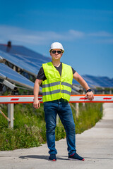 Fototapeta na wymiar Expertise service worker on measuring efficiency of operation and maintenance at solar plant.