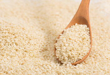  white sesame on wood spoon