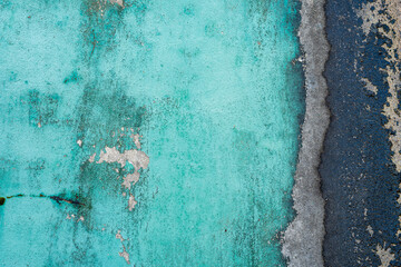 Turquoise blue concrete wall texture with dark vertical stain