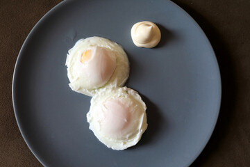 Two poached eggs with mayonnaise