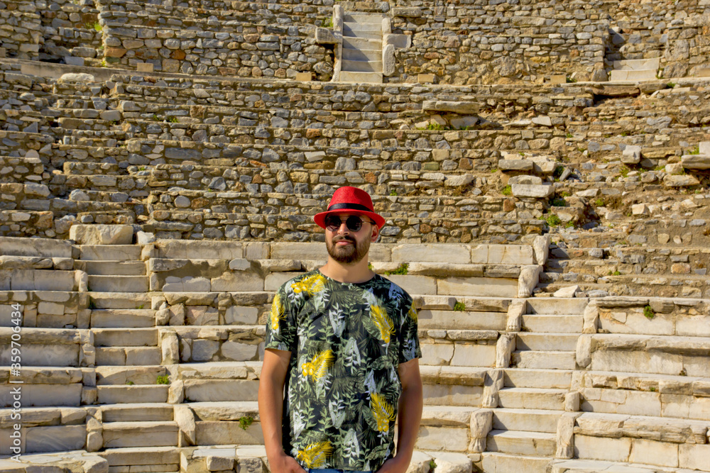 Wall mural young man in sunglasses in Ephesus Ancient City, Turkey